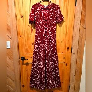 CUTE!!! ROMPER. VERY COMFORTABLE AND EASY TO WEAR. WORN TWICE. RED AND WHITE DOT